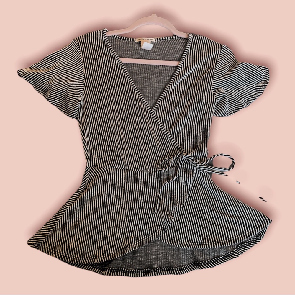 Women’s CAUTION TO THE WIND size LARGE ribbed black and white striped tie shirt.